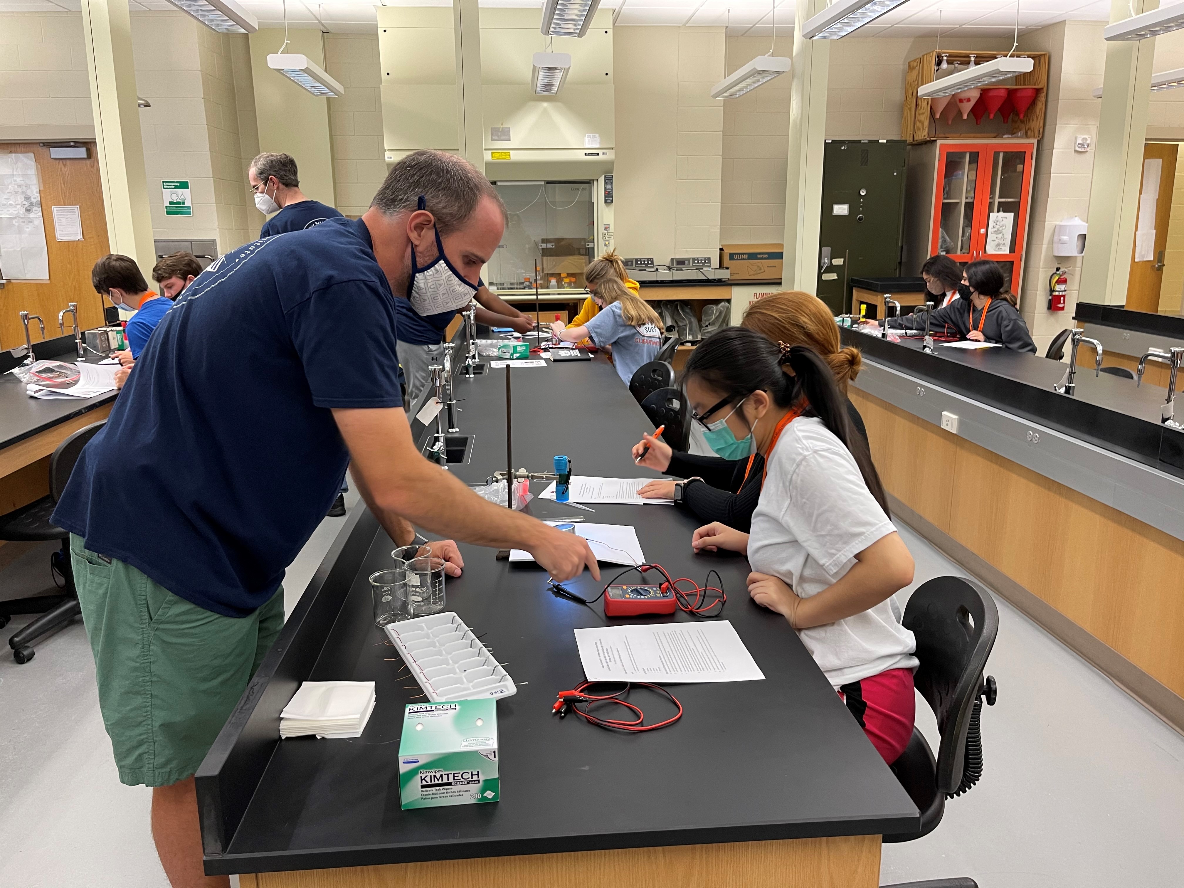 Student creating a battery in a lab