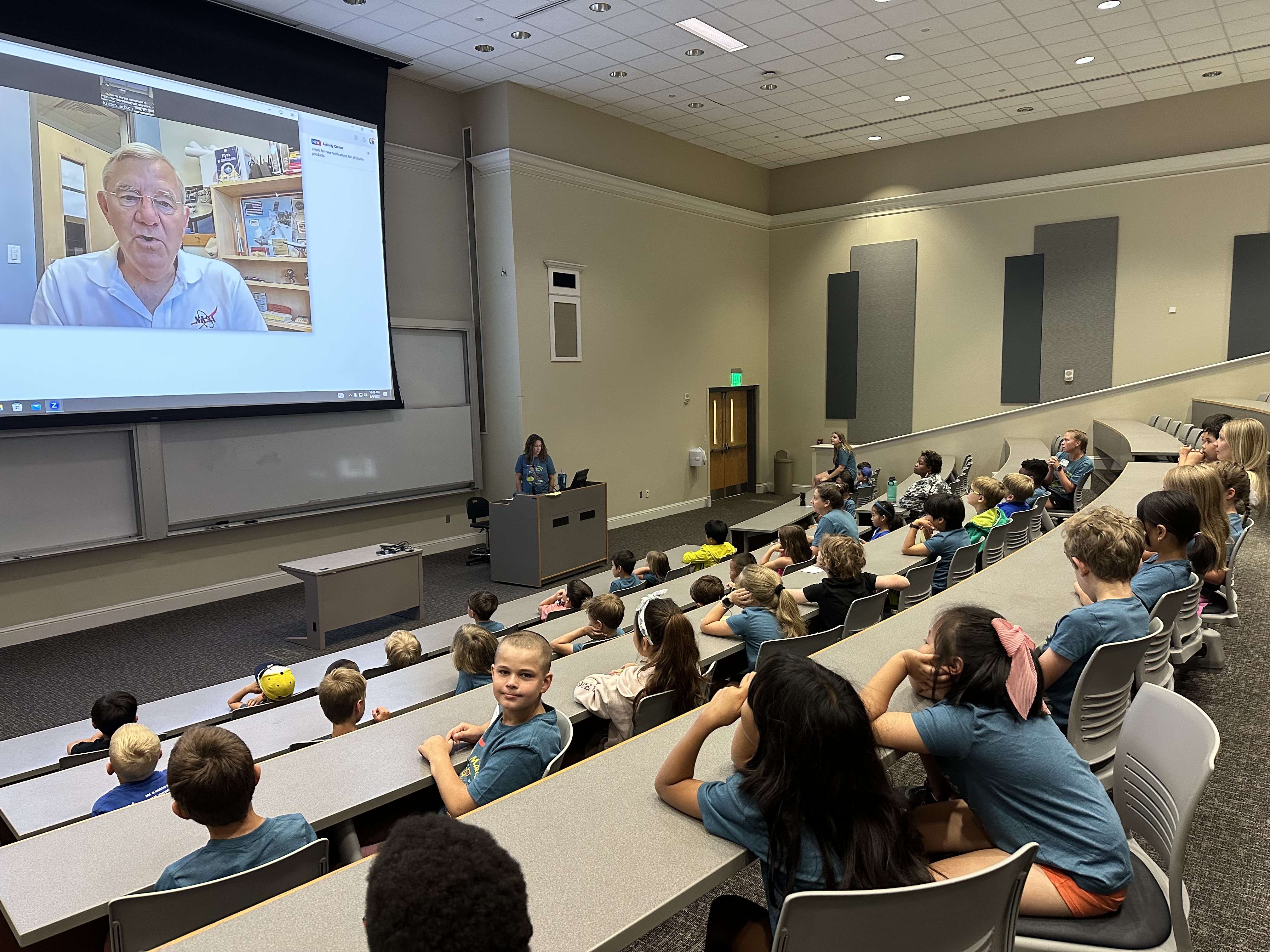 Students speaking with Colonel Voss from NASA