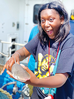 Girl holding a fish.