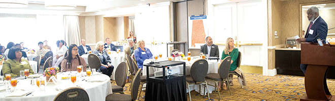 People gathered and seated for luncheon