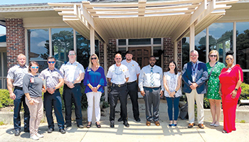 The Chambers County Community Health and Wellness Center team gather in front of the future site.