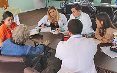 People sitting around a table discussing something