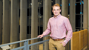 William Illiano poses for photograph in AU library