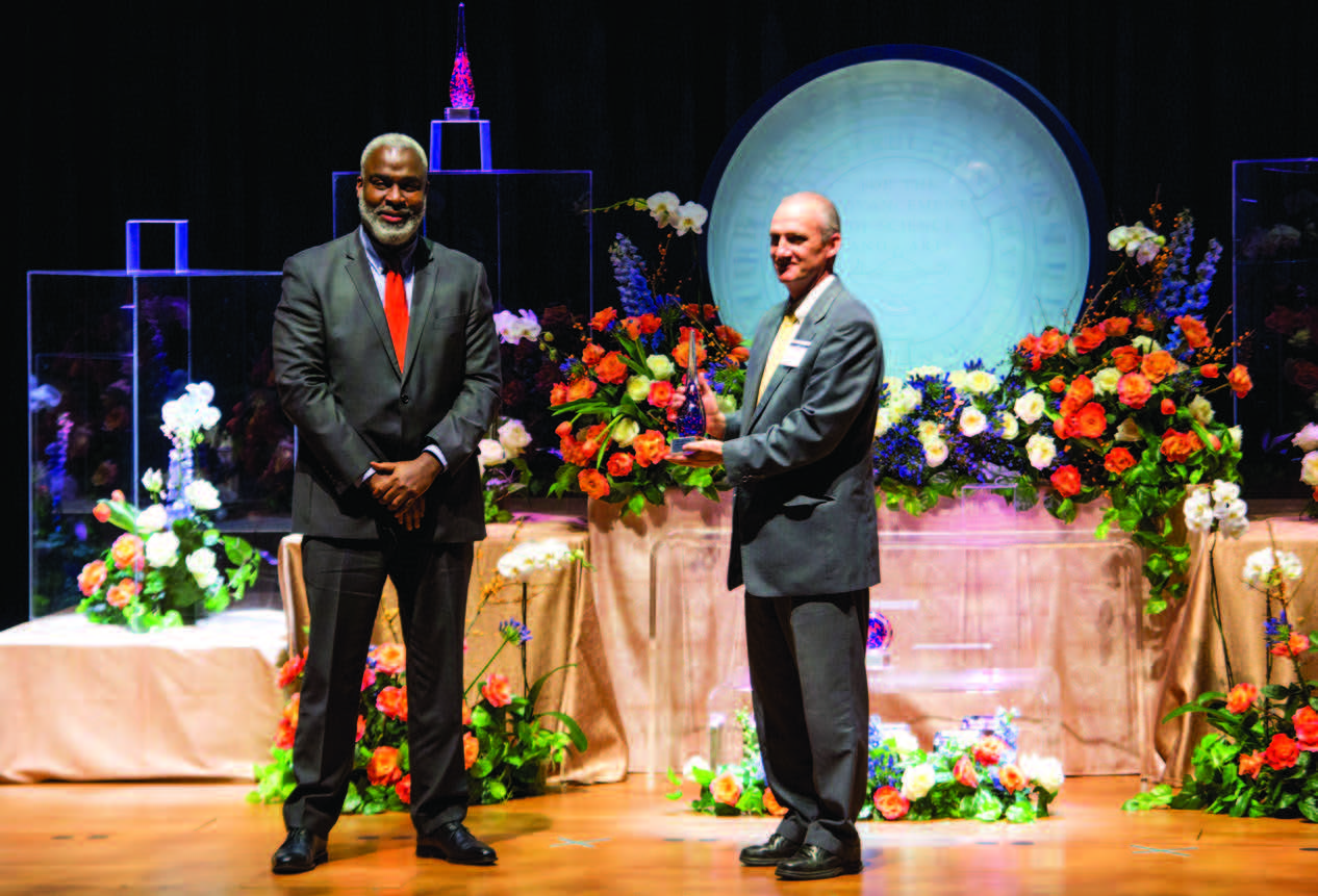 Dr. Cook and Steven Brown onstage at Faculty Awards presentation