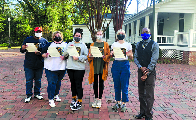 Students from the Appalachian Teaching Project are pictured with Dennis Powell, town of Shorter assistant community developer