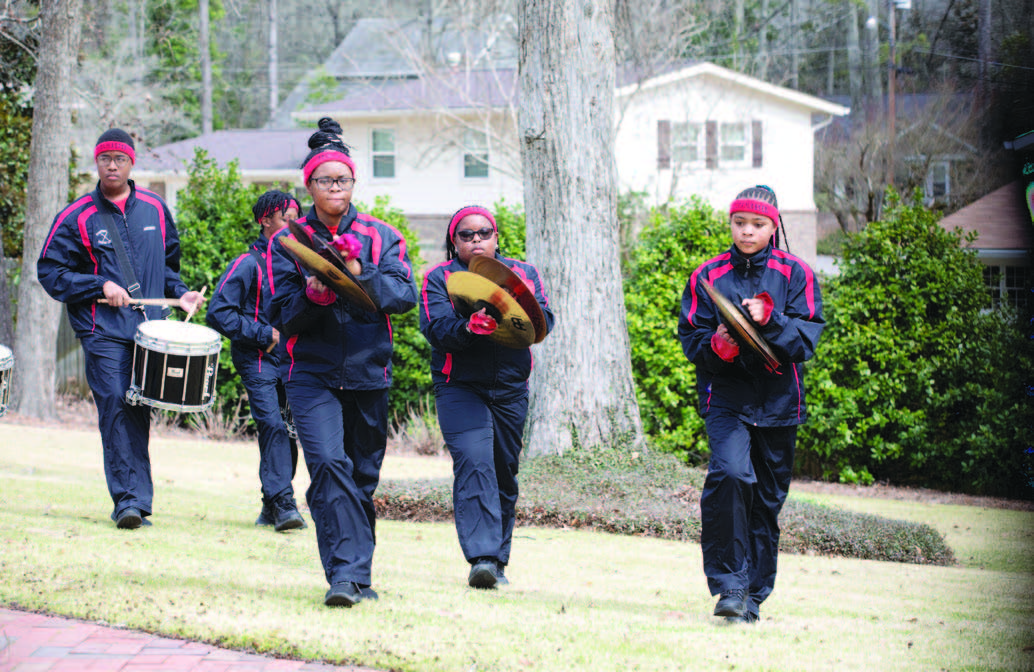 Students performing on cymbals.