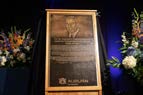 bronze plaque that holds the names of award recepients with an embossed photo of Dr. Cook (Royrickers Cook Endowed Engagment Award)