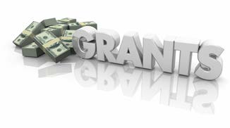 Graphic of bundles of money with the word Grants.