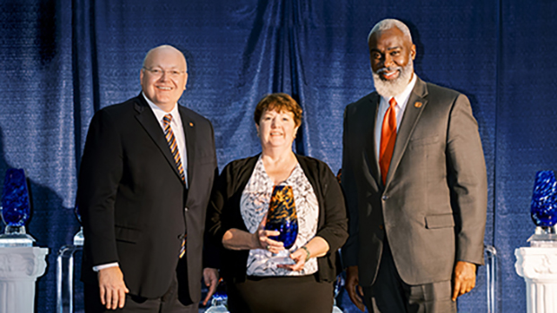 Dr. Roberts, Sefton (with her award) and Dr. Cook