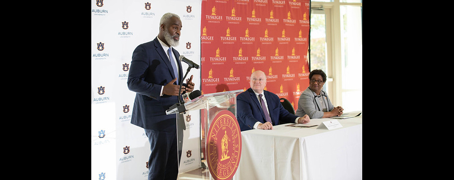 Auburn University's Royrickers Cook, vice president for outreach and associate provost, spoke about the endless potential for the new partnership between Auburn and Tuskegee University as Auburn President Christopher B. Roberts and Tuskegee President Charlotte P. Morris look on. Photo by Tanisha Stephens